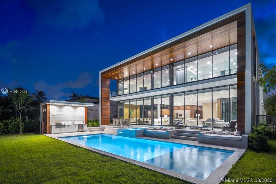 A Modern Waterfront Oasis on exclusive Allison Island. Allison Island Features 49 Waterfront only homes. Contemporary interior finishes along with expansive open living areas and spectacular rooftop terrace. The home features custom Ornare kitchen cabinetry and closets throughout. The ultra-luxurious master suite will not disappoint, featuring oversized his and her closets, master bathroom, sitting area and terrace extending along the entire east side of the house. Additional features include fully automated Lutron System, Roof Top Terrace, 1 elevator, completely furnished by Artefacto, 6 bedrooms plus staff quarters. The detached guest suite may be converted into a fitness studio. 3 car garage and private courtyard entrance along with 75 feet of water frontage.