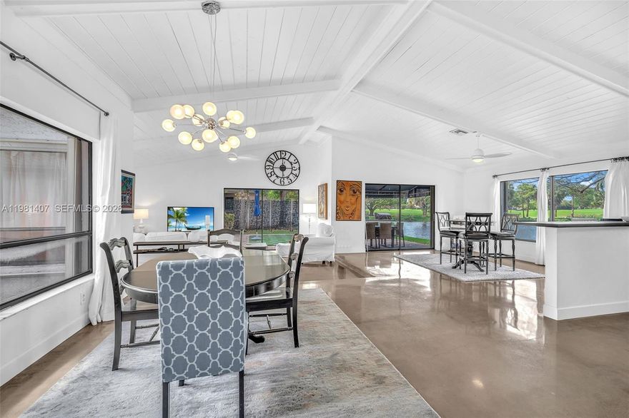 Experience refined So Florida living in this beautifully updated one story single family home perfectly positioned on the LARGEST LOT in the boutique community of Las Brisas. This home offers breathtaking lake and Jacaranda golf course views from every room creating a serene and private backdrop for everyday living & entertaining. The spacious, open floorplan with bright natural lighting features poured concrete throughout. LOW HOA, NEWER & NEW APPLIANCES AND AC, ACCORDION SHUTTERS THROUGHOUT,  A GENERATOR WITH TWO PROPANE TANKS. There is also an electric fence for your pets protection.(optional).  Community Pool and clubhouse.  Located close to highways, schools, shopping and restaurants.