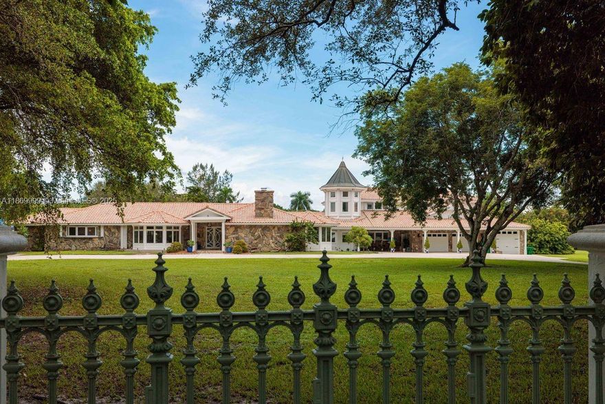 Tucked behind a private gated entry, this European-inspired estate offers timeless elegance and equestrian luxury on 3.1 manicured acres. 8,597 square feet, 8 bedrooms, and 5.5 bathrooms, the residence is designed for both refined living and unforgettable entertaining. A dramatic spiral staircase beneath soaring glass walls sets the tone, while imported finishes, high ceilings, panoramic views enhance every room. Grand ballroom with fireplace and French-imported bar flows into a glass-wrapped solarium and dining spaces filled with natural light. Equestrian facilities include a four-stall barn, riding pen, pastures, and a gazebo with pond views. This estate is more than a residence it’s a sanctuary, a lifestyle, and rare opportunity to own a piece of European-inspired equestrian luxury.