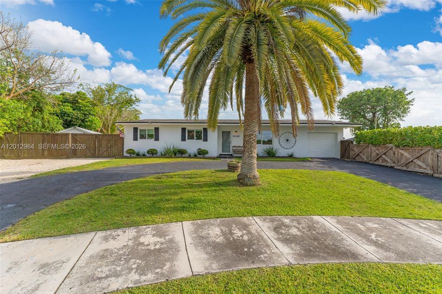 18,000 SF LOT | TWO FULLY SEPARATE LIVING SPACES | Properties like this simply do not come up. Perfectly positioned between Biscayne National Park and the Everglades on a MASSIVE 18,000 SQUARE FOOT LOT, this one-of-a-kind compound delivers the space, privacy, and versatility that South Florida buyers have been searching for. The main residence stuns with an open-concept layout, CHEF'S KITCHEN WITH CENTER ISLAND, and rich wood ceiling accents flowing seamlessly into a spectacular covered pergola built for entertaining. The FULLY SEPARATE SECOND UNIT features epoxy floors, a utility sink area, and its own private entrance — ready to become a guest suite, in-law quarters, or home business. Step outside and enter your own PRIVATE TROPICAL OASIS — a serene koi pond, fire pit lounge, mature fruit trees, and multiple outdoor entertaining areas that make every day feel like a retreat. A DETACHED WORKSHOP adds yet another layer of versatility to an already extraordinary property. Minutes from major highways and South Dade Park. This is pure, unapologetic South Florida living on a scale that is nearly impossible to find at any price.