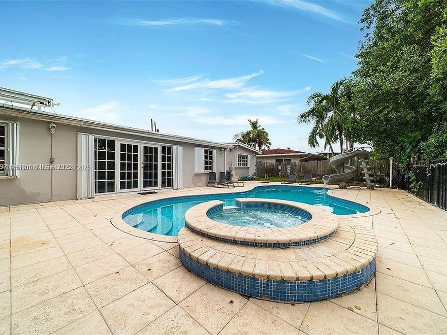 Waterfront 5-bedroom, 3-bath pool home with waterslide in sought-after Enchanted Lake! Enjoy ocean-access canals perfect for jet skis. Located in a quiet, family-friendly community with top-rated schools. Currently a successful short-term rental, offering strong income.