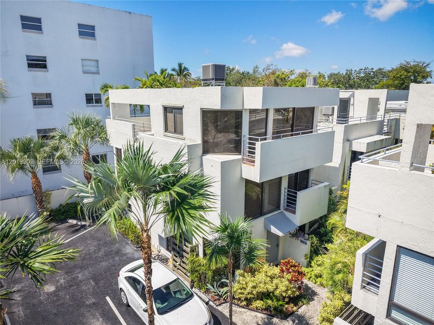 Artists and lovers of natural light will love this three level Townhouse Style condo..  As you enter the main level you are immediately embraced by the feeling of openness offered by the vistas of the  private walled tropical patio.  The living room, dining area, kitchen and walled patio are all on the main level.  Ascend the spiral stairs to the 2nd floor with guest bedroom and bath and laundry area. The primary suite with bath is located on the 3rd level. This is a serious Seller, all reasonable written offers will be considered.  Agents, please see Broker Comments.