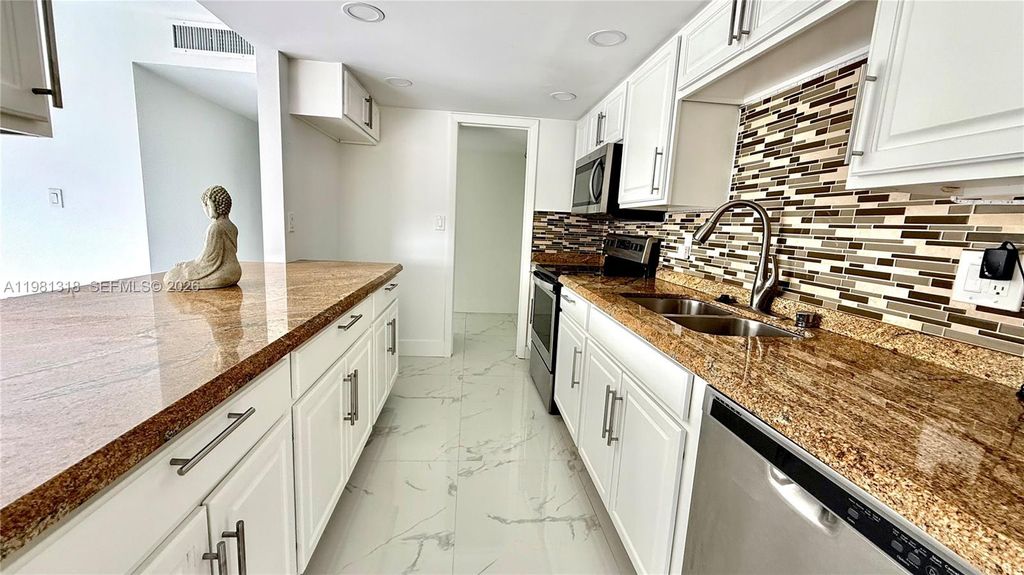 Photo of 4174 Inverrary Dr #402, Lauderhill, FL 33319 (MLS # A11981318)