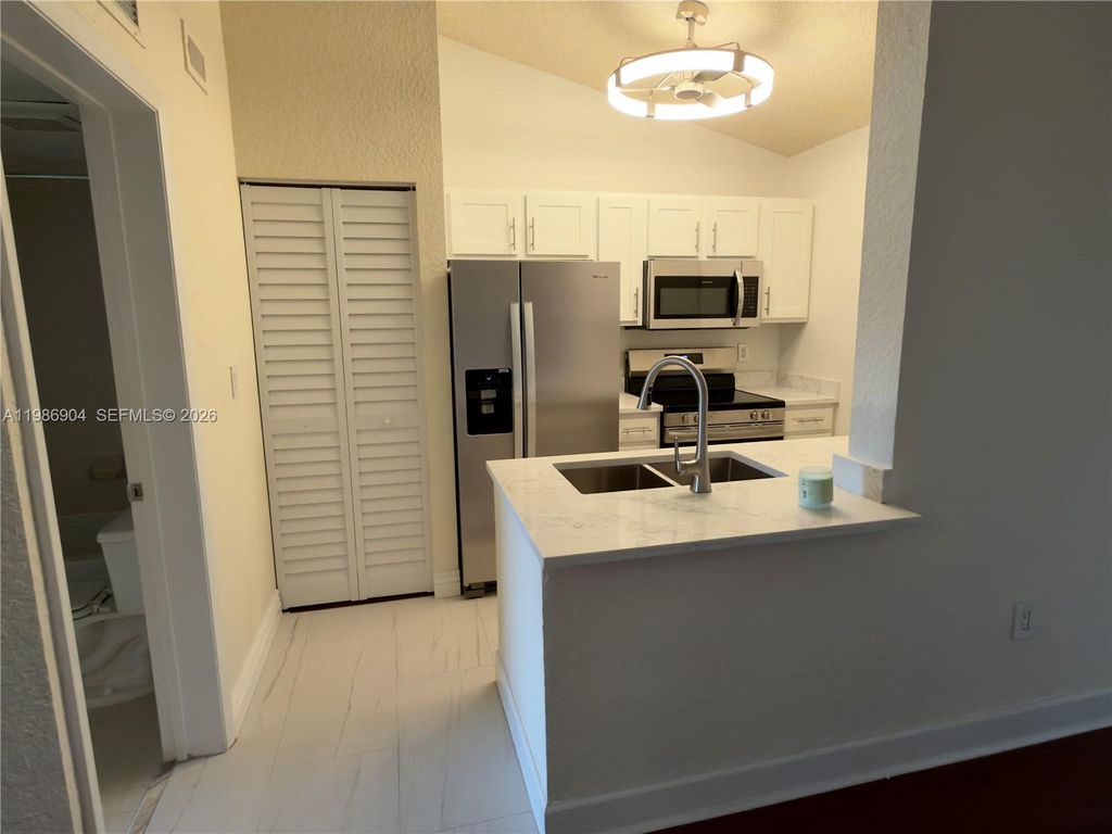 Photo of 2851 N Oakland Forest Dr #305, Oakland Park, FL 33309 (MLS # A11986904)