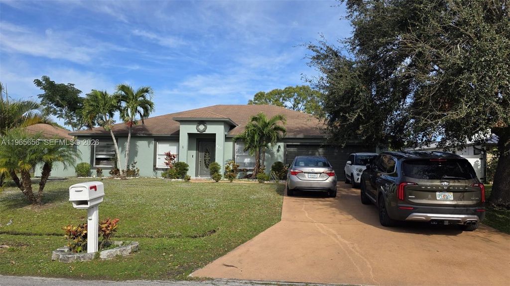 Photo of 825 SE Cavern Ave, Port St Lucie, FL 34983 (MLS # A11965656)
