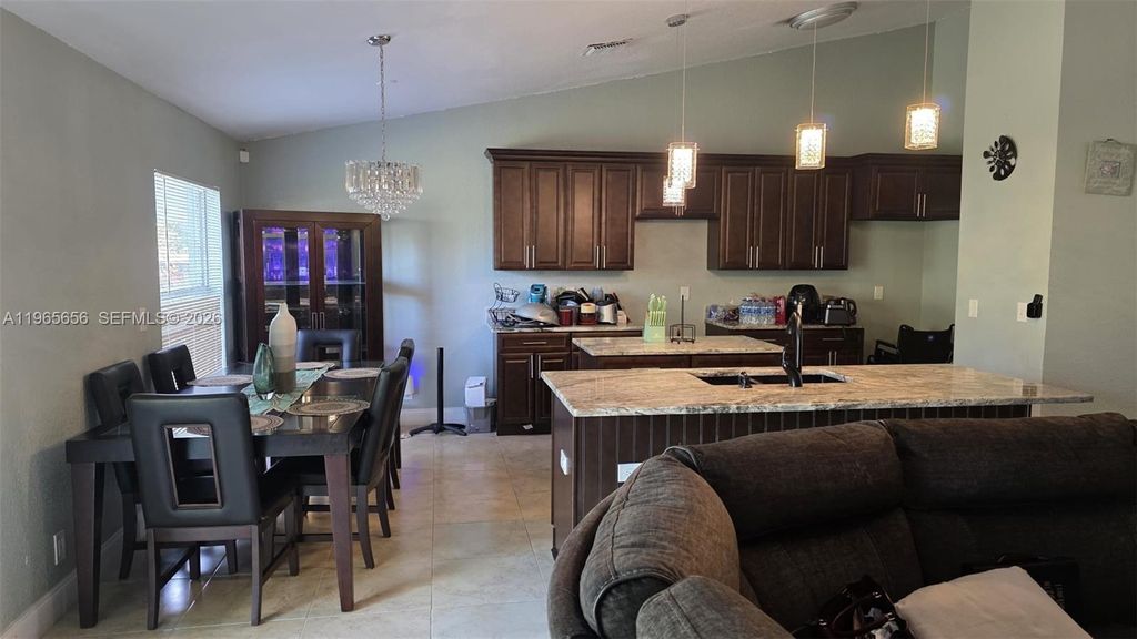 Photo of 825 SE Cavern Ave, Port St Lucie, FL 34983 (MLS # A11965656)