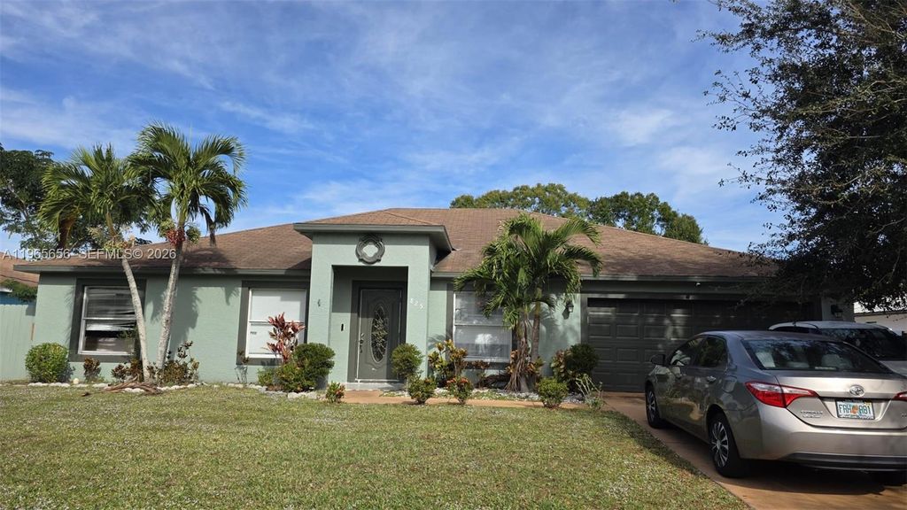 Photo of 825 SE Cavern Ave, Port St Lucie, FL 34983 (MLS # A11965656)