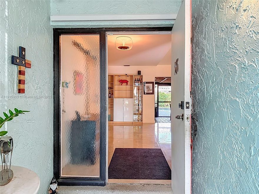 READY FOR YOUR NEW HOME? JUST IN TIME FOR THE HOLIDAYS! You will fall in love with this sweet home filled with lots of natural light, and loving energy. Who needs air conditioning when you can open the front door and the sliding glass doors leading to the screened patio and enjoy the breeze? Updated 3-bedroom, 2-bath pool home in a highly desired Pembroke Pines neighborhood. The open kitchen was remodeled with Corian countertops and beautiful cabinetry from Kentucky. Lots of counter space for those who enjoy having space to prepare their favorite dishes. The living area offers high ceilings and direct access to a large screened-in patio overlooking the backyard, which features mango and avocado trees and a free-form pool. The two bedrooms share a remodeled bathroom with a spacious shower complete with a rain shower. The primary bedroom overlooks the swimming pool, providing a peaceful retreat. The master bathroom is perfect with dual sinks, oversized shower and a separate freestanding bathtub. Additional features include impact windows and 1,805 sq ft of well-designed living space on a 7,009 sq ft lot. You will fall in love with this home.