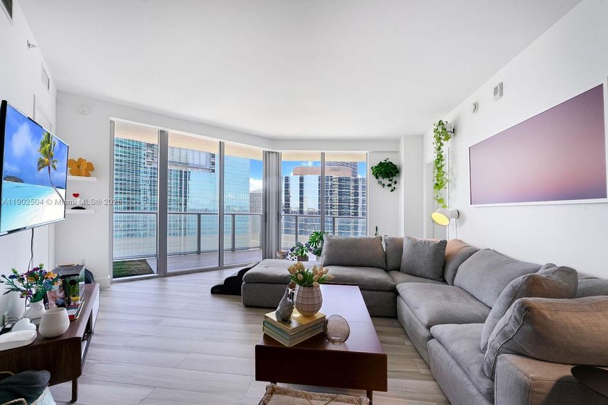 Experience elevated living in this stunning corner residence at Brickell House. Perched on the 29th floor, this 2-bedroom, 2.5-bath home features a spacious split layout with floor-to-ceiling glass and an expansive wraparound balcony offering panoramic city views. The interiors boast a sleek open kitchen with high-end stainless-steel appliances, porcelain floors throughout, custom closets, and blackout shades in the bedrooms. Enjoy resort-style amenities including a rooftop pool and sundeck, lap pool with cabanas, state-of-the-art fitness center, spa, theater, and club room. Perfectly positioned in the heart of Brickell, steps from Brickell City Centre, Equinox, top restaurants, and the bayfront.