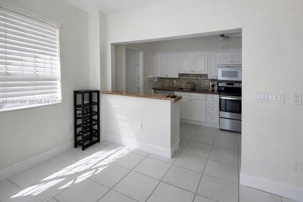 Photo of 462 Golden Isles Dr #210, Hallandale Beach, FL 33009 (MLS # A11991168)