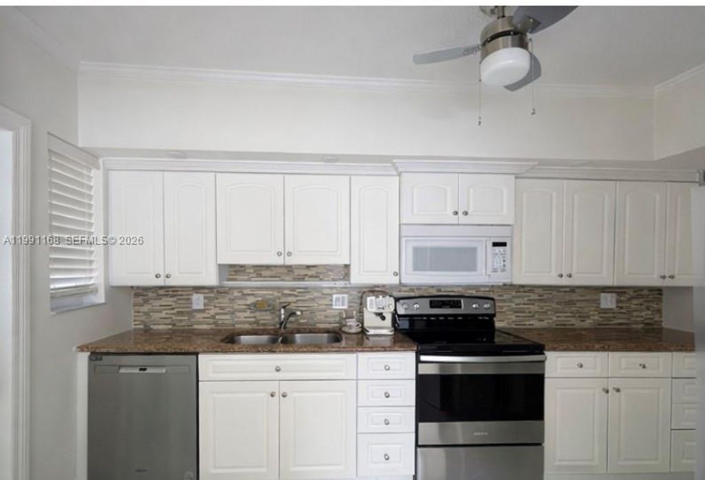 Photo of 462 Golden Isles Dr #210, Hallandale Beach, FL 33009 (MLS # A11991168)