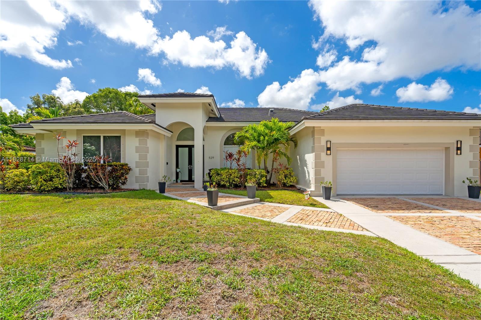 Beautiful home in the heart of Miami Springs. This residence offers high ceilings, an abundance of natural light with porcelain tiles running seamlessly throughout the home. Featuring 4 spacious bedrooms, 2.5 bathrooms, and a double-car garage, the home blends modern design with functional living space. Gourmet kitchen equipped with high-end stainless steel appliances, including a double oven, integrated cooktop, a custom-paneled built-in refrigerator, and wine fridge. Enjoy outdoor living with a covered terrace, perfect for relaxing or entertaining. Ideally located just five minutes from Miami International Airport and right next to Miami Springs Golf Course, tennis courts, new community center with two full-size basketball courts, and a newly built community pool. Top-rated "A" schools.