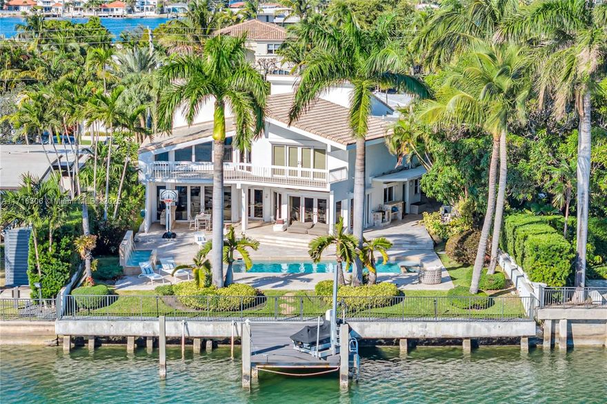 Nestled in the gated community of Biscayne Point, Miami Beach, this elegant 1980-built residence offers 4 bedrooms and 5.5 bathrooms across 4,642 square feet. Enjoy 75 feet of open bay with direct ocean access, perfect for a waterfront lifestyle. The property features a combined leisure area with a pool, hot tub, jet ski lift, and dock. Situated on an expansive 11,250 square foot lot, it offers a walk to the beach and close proximity to Bal Harbour Shops and fine dining restaurants. Experience refined Miami Beach living, blending classic charm with modern luxury.