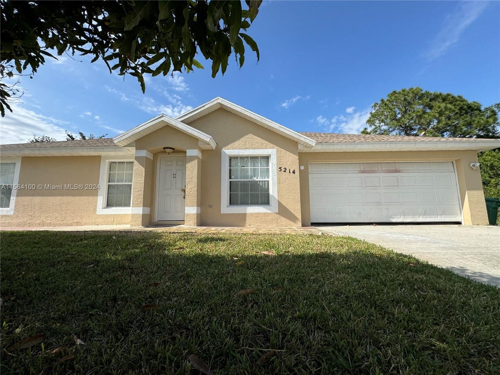 Photo of 5214 NW Mulga Ct, Port Saint Lucie, FL 34986 (MLS # A11564100)