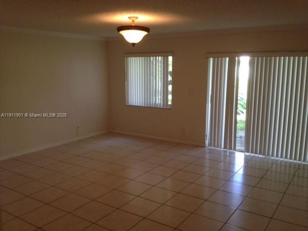 Photo of 5827 NW 57th Ave #5827, Tamarac, FL 33319 (MLS # A11911901)