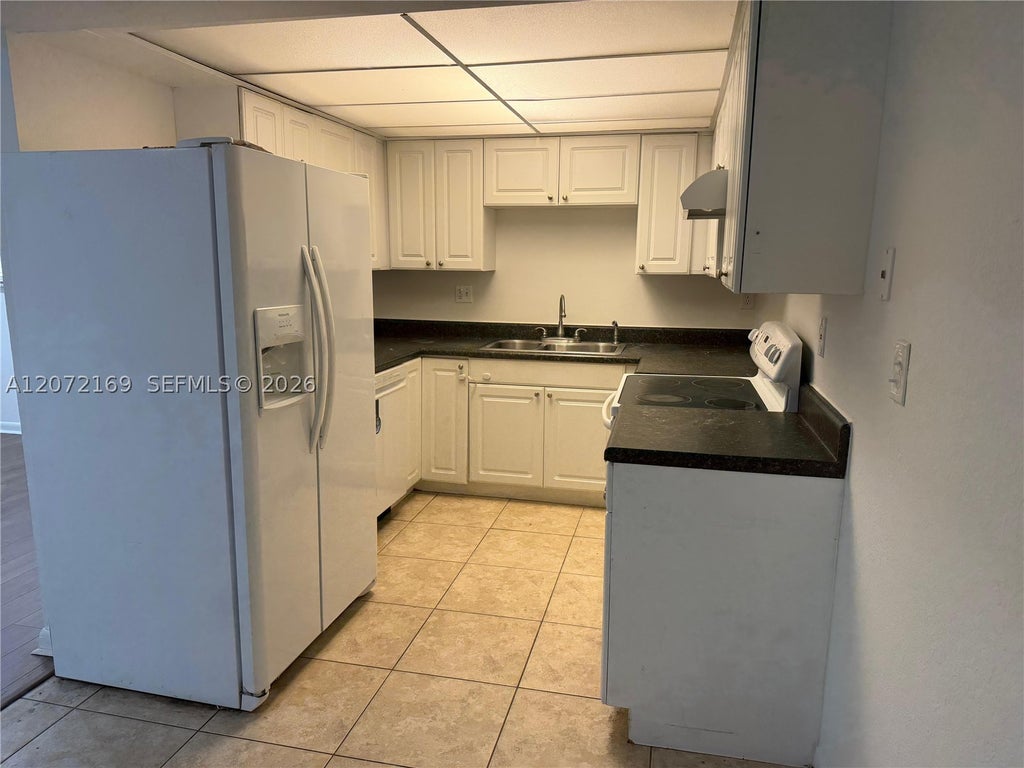 Photo of 11101 Royal Palm Blvd #203, Coral Springs, FL 33065 (MLS # A12072169)