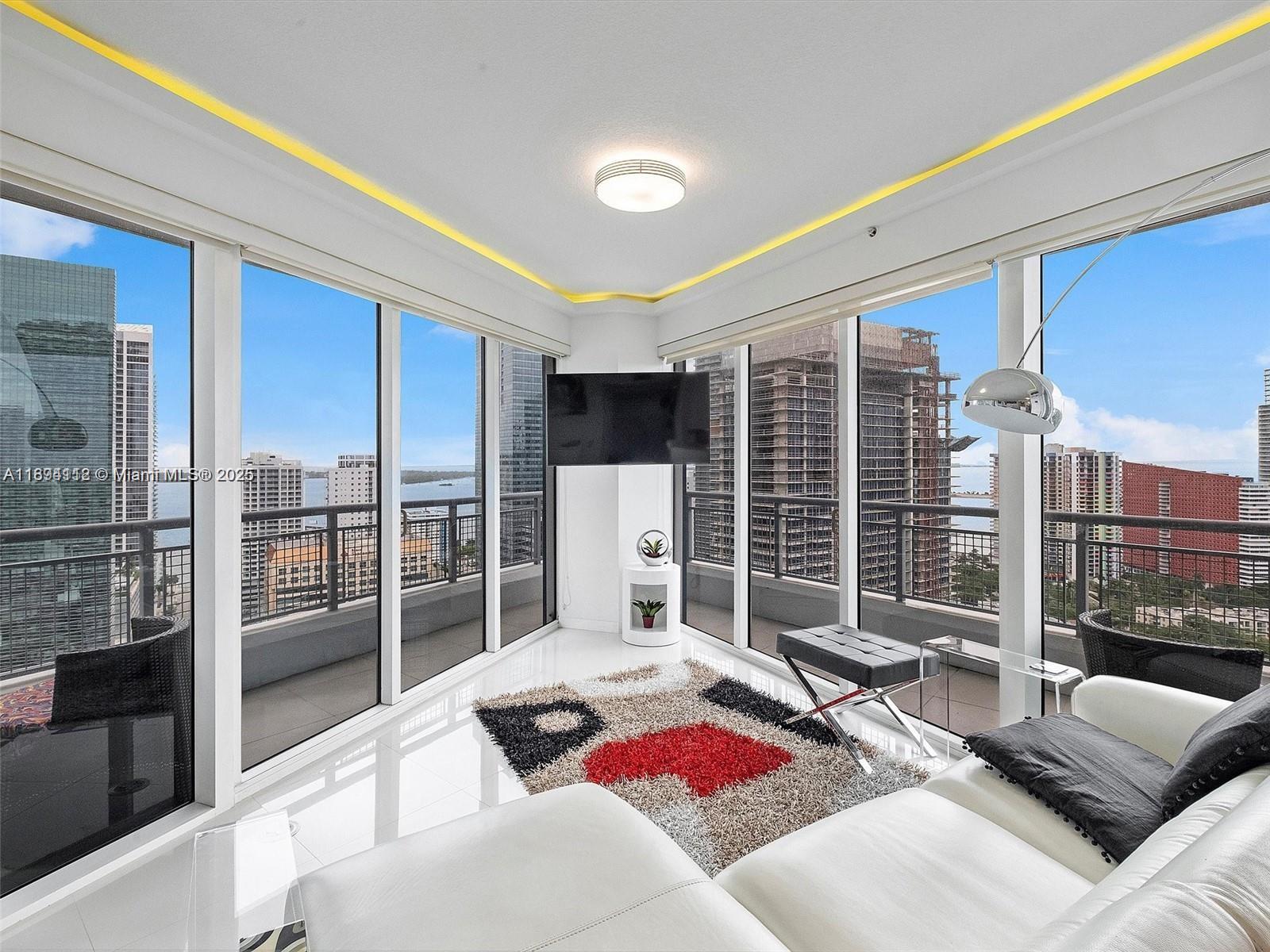 Best Corner Unit - 2 Bed & 2.5 Baths - Experience luxury living in this expansive one-floor condo, offering stunning views of the clearest bay waters and a mesmerizing skyline that lights up beautifully at night. This apartment is part of the exclusive #00 line, where the elevator serves only four units on this floor, enhancing your privacy. It features exceptional finishes, including designer wooden closets, an upgraded powder room, LED lighting throughout, and a Murphy bed. The building is fully staffed and equipped with top-notch amenities such as a swimming pool, gym-spa, jacuzzi, and valet parking services. You'll be moments away from premier restaurants, City Centre shops, cinemas, and just a short drive from the beach. This opportunity is rare - Make it Yours!