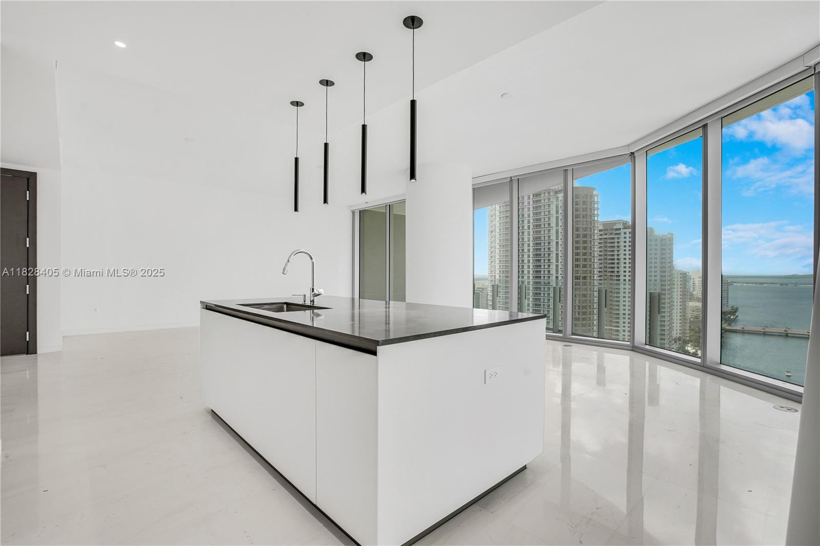 Experience the pinnacle of luxury at Aston Martin Residences, where every detail embodies elegance and style. Ride a private elevator to your personal foyer, leading into a breathtaking 3-bedroom, 3.5-bathroom haven. Marvel at the expansive city skyline and shimmering waters through floor-to-ceiling windows, all from a spacious open-concept living area adorned with top-tier finishes, reflecting Aston Martin's iconic design. Each bedroom offers an intimate sanctuary, featuring en-suite bathrooms and bespoke closet spaces. Indulge in exclusive amenities that include a state-of-the-art fitness center, an infinity-edge pool, and curated lounges, all crafted for a world-class living experience. Own a masterpiece of architectural art that redefines luxury living.