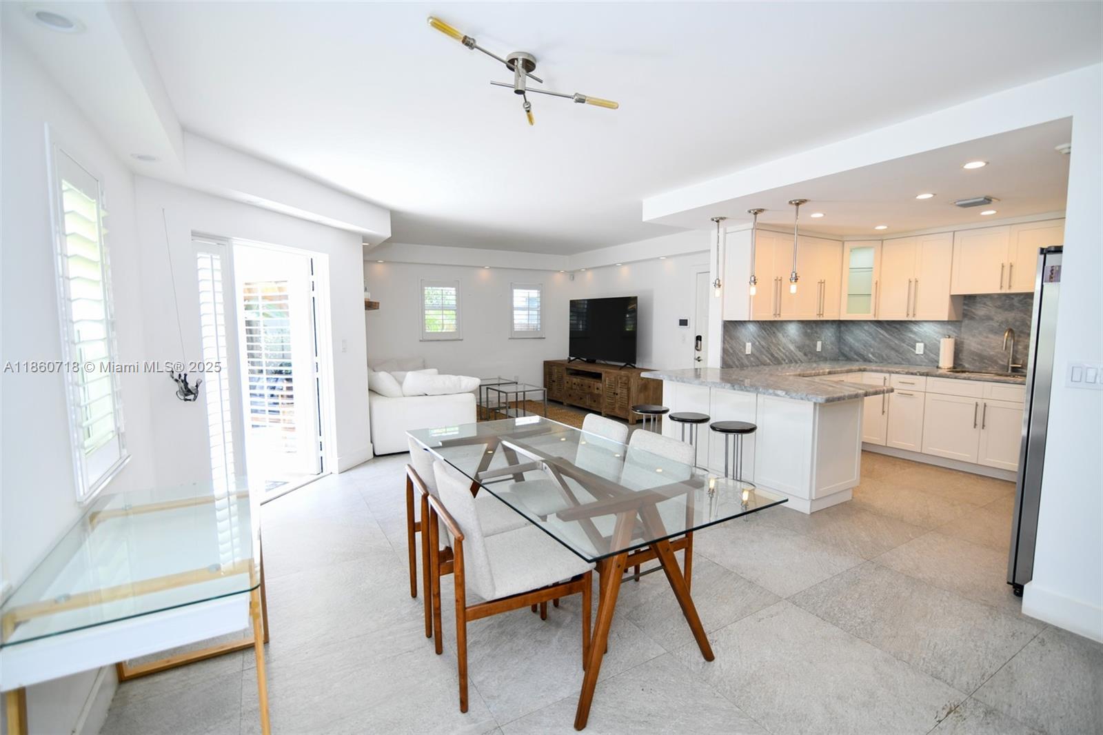 Spectacular 1BR/1BA apartment in the heart of Coconut Grove with lovely private patio and grilling area. Renovated kitchen and bathroom with walk-in shower. Recently painted. Open kitchen with granite countertops, modern lighting features and stainless-steel appliances, washer/dryer in the unit. This unit is offered with private parking space for electric car. The moment you walk-in, this ground floor apartment will captivate you!