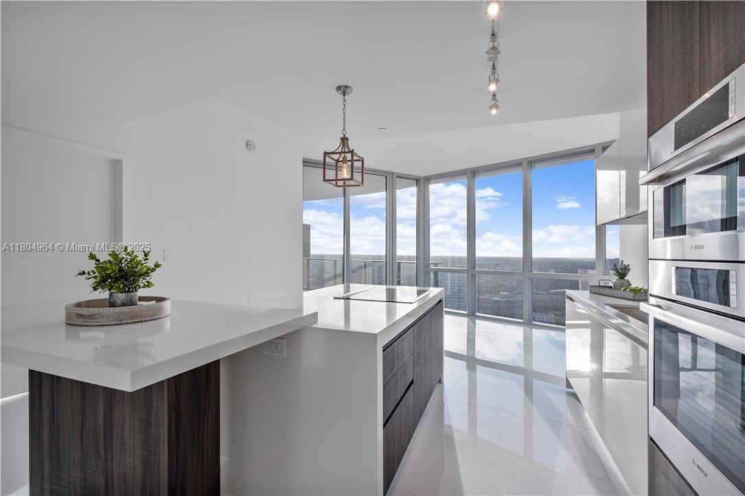 Motivated Seller. Resort-style living in this stunning 2 bed, 2 bath, located in one of Miami’s most sought after high-rise developments. Boasting sleek modern finishes, floor to ceiling windows, and an open-concept layout, this unit offers breathtaking views of the city skyline. The gourmet kitchen features premium appliances, quartz countertops, and Italian cabinetry—perfect for entertaining or everyday elegance. Both bedrooms offer spa-inspired en-suite bathrooms and spacious walk-in closets, while the expansive balcony provides the ideal space to unwind and take in the vibrant Miami energy. Amenities include a resort-style pools, spa, gym, business lounge, basketball court, outdoor soccer, cinema and much more. Walking distance to top dining, shopping, and cultural attractions.