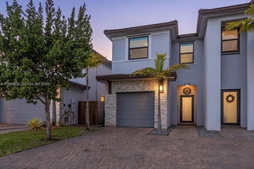 Stunning 3-bedroom, 2.5-bath twin home offering the perfect blend of style, space, and comfort! This beautifully maintained property features high ceilings and abundant natural light throughout, creating a bright and inviting atmosphere. The modern kitchen boasts a huge island, perfect for entertaining, along with ample cabinetry and modern finishes. Enjoy tile flooring on the main level and wood laminate upstairs, along with plenty of closet space for all your storage needs. Step outside to a spacious fenced backyard complete with a pergola and stamped concrete terrace—ideal for relaxing and hosting gatherings. Additional highlights include impact windows and doors, a one car garage, resort style community amenities, and a prime location close to major highways, top-rated schools, shopping, and dining. A true must-see!