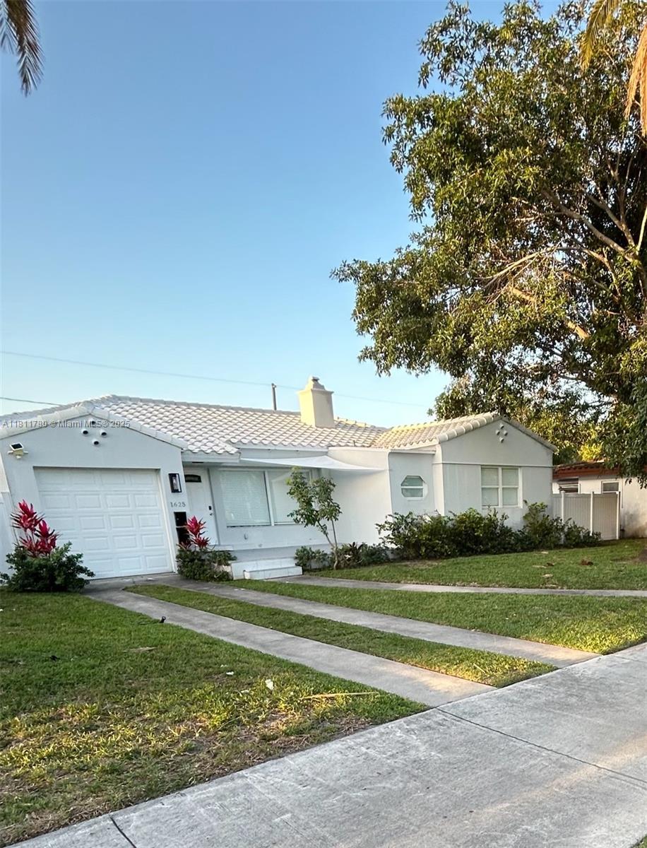Exquisitely furnished and fully remodeled home for rent in the sought-after Hollywood Lakes area, east of Dixie Hwy and next to the ArtsPark at Young Circle. This unique property offers two separate homes on one lot: the front house features 3 beds and 2 baths; the rear guest house includes 2 beds and 1 bath. Main entrance on iconic Hollywood Blvd, plus rear access and private parking. The home feels like new. Walk to the beach, shops, and restaurants. Just minutes from Fort Lauderdale Airport and Port Everglades. Ideal for extended families or those seeking comfort and style in a prime location! Short term rental also an option!