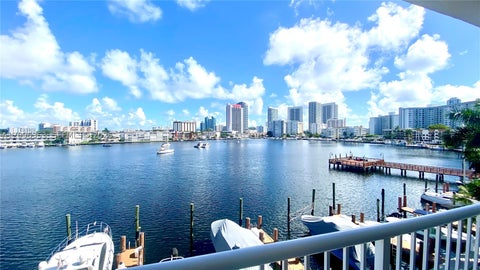 Photo of 410 Golden Isles Dr #407, Hallandale Beach, FL 33009 (MLS # A12096353)