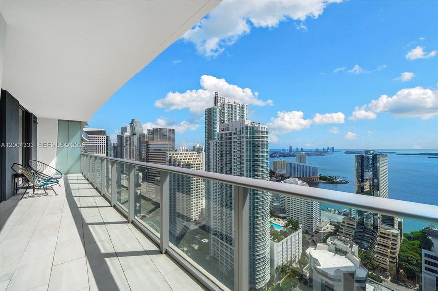 Luxury living at its finest in the heart of Brickell! This east-facing, high-floor residence at 1010 Brickell features 2 bedrooms, 3 bathrooms + den, private elevator, and 1 parking space. The open layout offers 9 ft ceilings, ceramic tile flooring, and large balcony with spectacular views of the Brickell skyline and Biscayne Bay. The versatile den can serve as a 3rd bedroom, dining room, nursery, office, or media room. Enjoy world-class amenities including a 50th floor rooftop pool, restaurant, and outdoor movie theater, co-ed Hammam spa w/ hot and cold Jacuzzis, massage rooms, sauna & steam rooms, indoor heated pool with retractable glass walls, fitness center, yoga room, basketball & squash courts, running track, kids playground, bowling alley, virtual golf simulator, and party rooms.