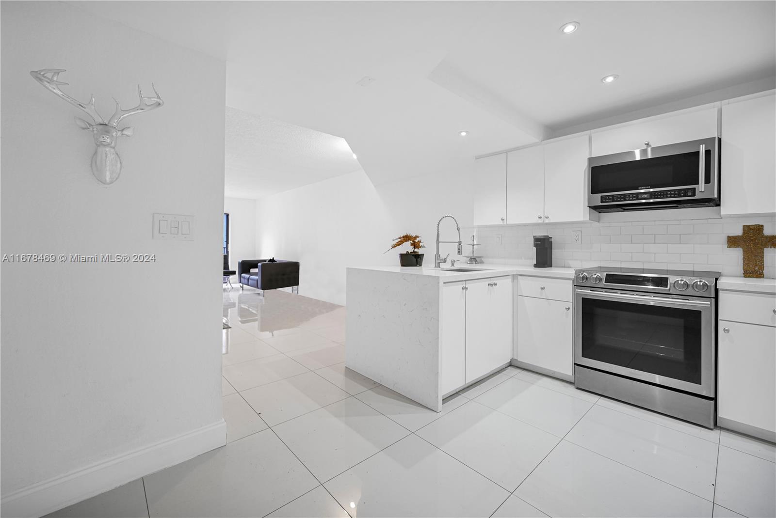Fully renovated 2-story condo in the heart of Hialeah! This turn-key unit features 2 spacious bedrooms and 1.5 baths, with a modern open layout and high-quality finishes throughout. The kitchen is equipped with high-end stainless steel appliances, luxurious granite countertops, and sleek tile flooring, ensuring every corner radiates elegance. The renovated bathrooms add a fresh, contemporary touch, and the in-unit washer/dryer provides extra convenience. Centrally located near major highways, parks and shopping plazas. This condo is perfect as a primary residence or investment opportunity.