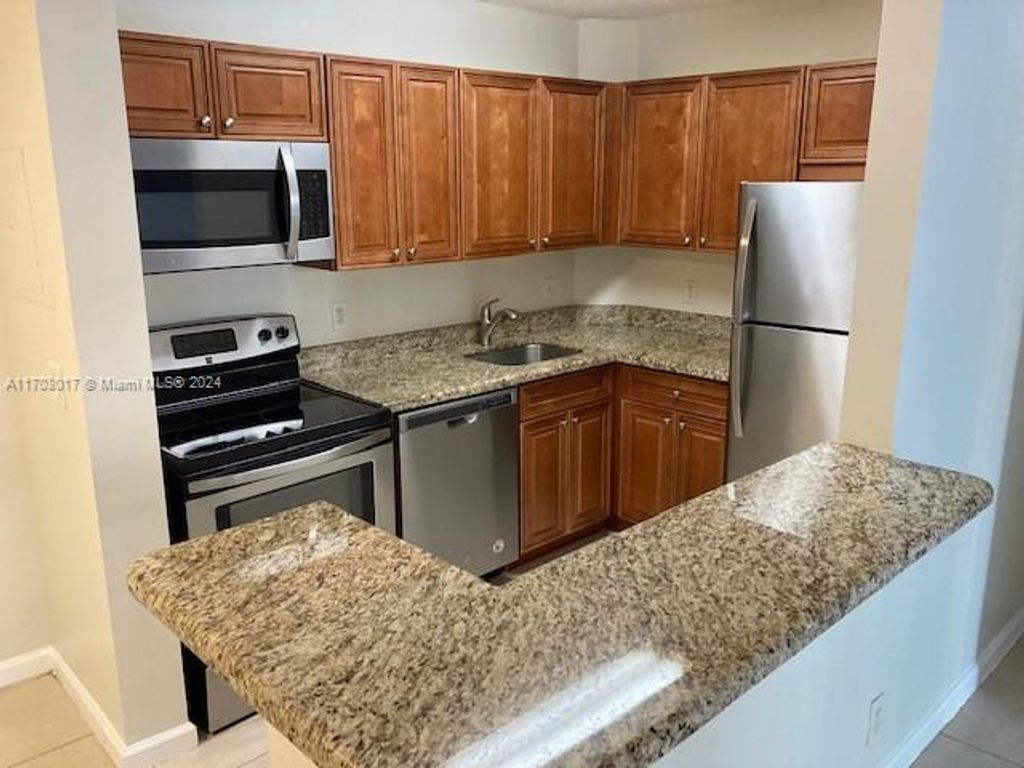 Photo of 10765 Cleary Blvd #103, Plantation, FL 33324 (MLS # A11703017)