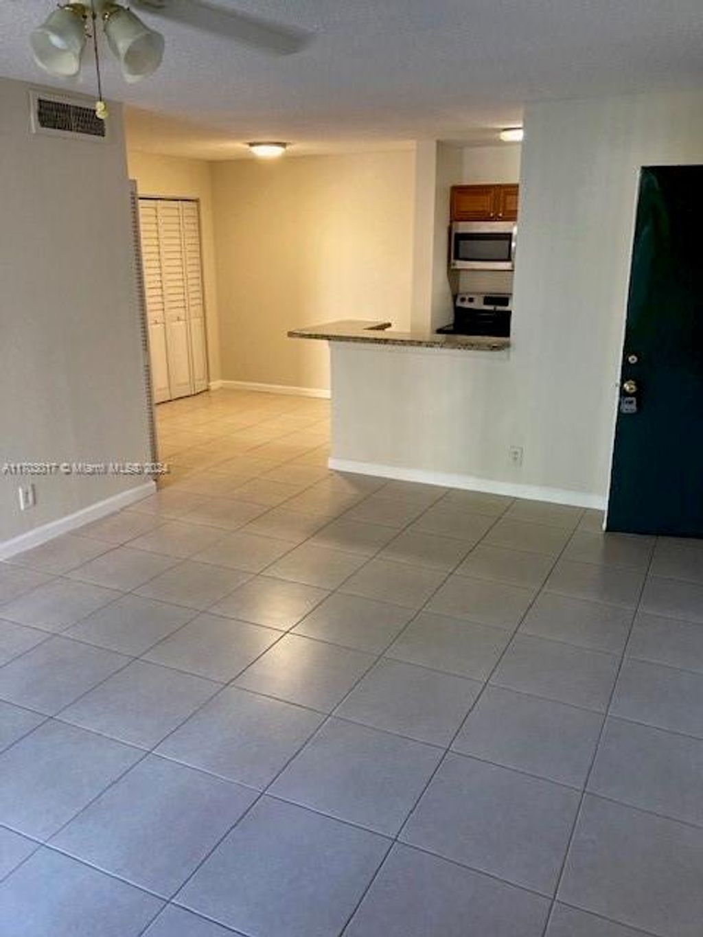Photo of 10765 Cleary Blvd #103, Plantation, FL 33324 (MLS # A11703017)