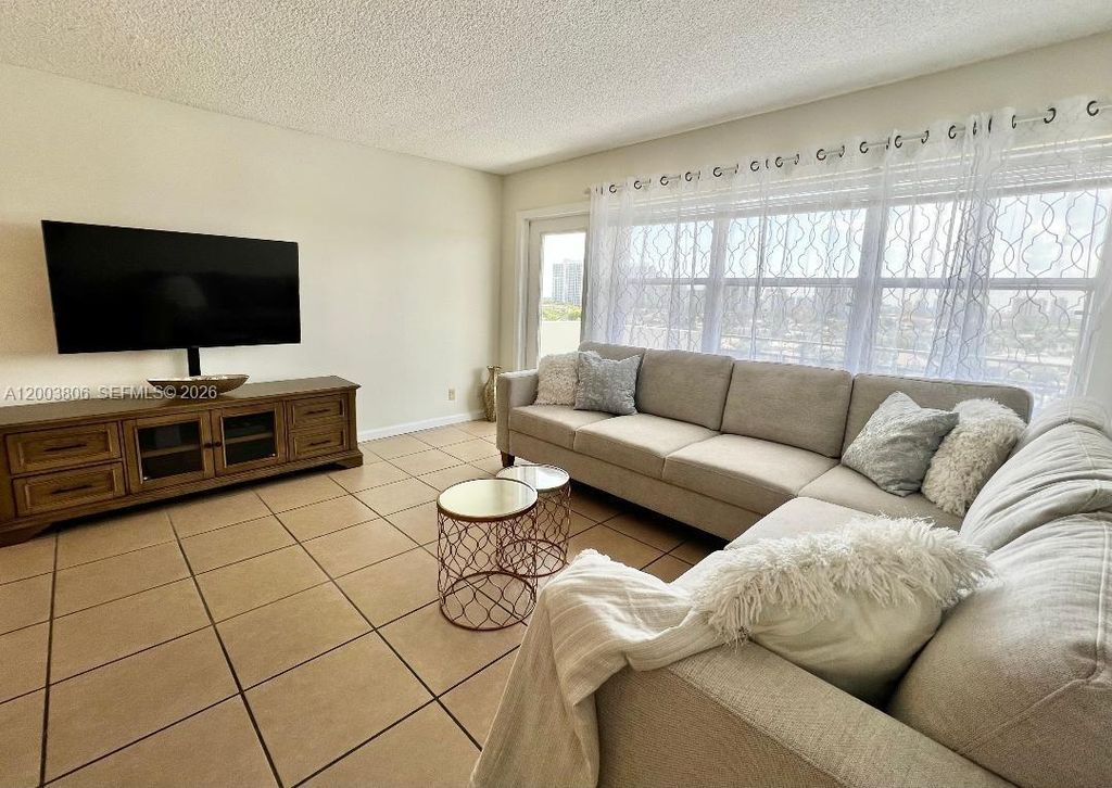 Photo of 401 Golden Isles Dr #1011, Hallandale Beach, FL 33009 (MLS # A12003806)