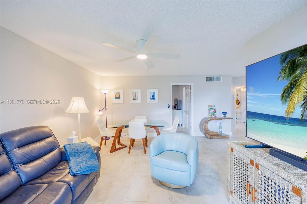 Photo of 9100 Lime Bay Blvd #111, Tamarac, FL 33321 (MLS # A11961776)