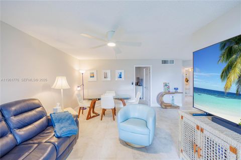 Photo of 9100 Lime Bay Blvd #111, Tamarac, FL 33321 (MLS # A11961776)