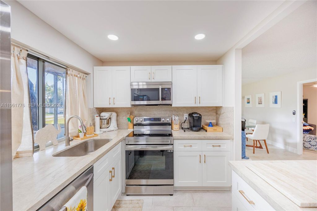 Photo of 9100 Lime Bay Blvd #111, Tamarac, FL 33321 (MLS # A11961776)