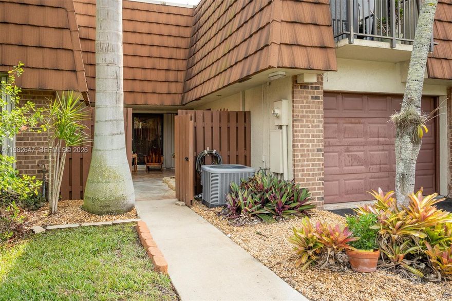 Hidden gem in Village of Lake Pines II offering spacious living areas filled with natural light and gorgeous LAKE views!  Features a modern kitchen with updated appliances, GRANITE countertops, pantry, dining room and comfortable living room. Large master with en-suite, Terrazzo tile, 2 additional bedrooms, 2 1/2 baths total, office/den, upstairs laundry room, attached garage, laminate flooring. Relax outside in the front courtyard or back patio facing the lake. Conveniently located near local shops, dining, parks, bike paths.  Enjoy the community pool, bbq, playground, basketball, tennis, pickleball and top rated schools!  MUST SEE this inviting home! Newer appliances, hurricane windows, roof in 2019 (warranty through 2039), AC replaced in 2018.