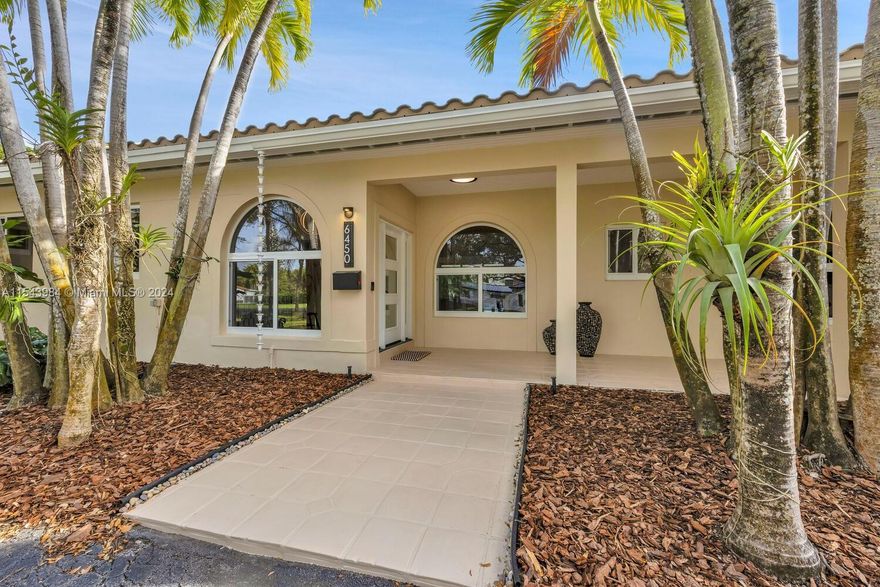 Welcome to paradise! This 1-story 5 BR/5BA + office home provides wonderful privacy ideally situated in the Pinecrest Elem School district on a no-thru street, yet close to it all. We aren't sure what you'll like better-the builder's acre lot w/ enough room for a soccer game or house expansion, or the house itself which is not your typical Pinecrest ranch! High ceilings thruout the living spaces are an unexpected surprise, and the list of updates is impressive. All impact windows & doors, luxury vinyl flooring, gorgeous kitchen w/ cooking island & new appliances, newer a/c & ducts, 2 new septic systems, updated plumbing (sleeve & pvc) & new flat roof. The pool & patio area are the perfect spot to relax at the end of the day, and a koi pond with yellow-belly-turtle is the icing on the cake.