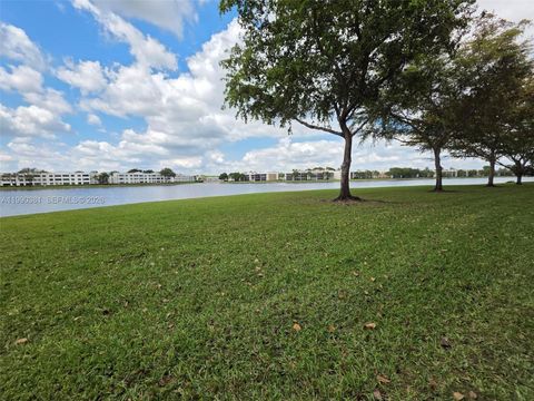 Photo of 7611 Southampton Ter #110, Tamarac, FL 33321 (MLS # A11990381)