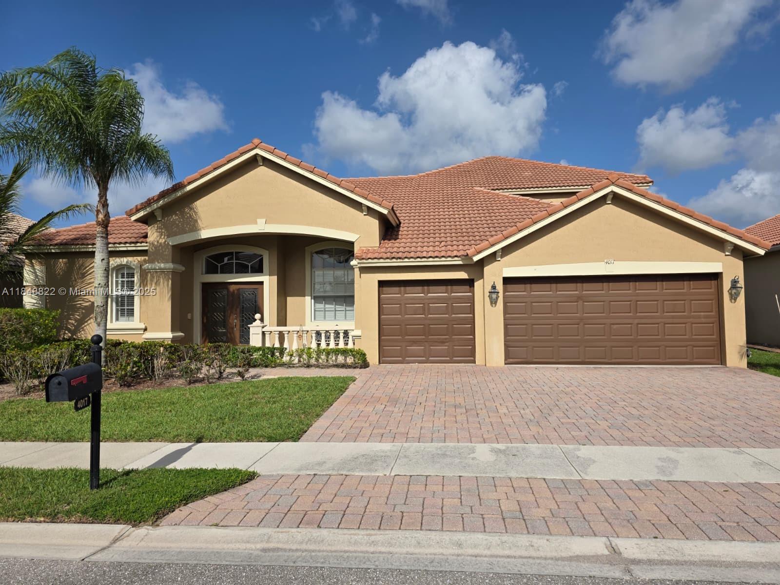 Discover 4017 W Hamilton Key, West Palm Beach, FL?33411: a stunning 5-bedroom, 4-bath single-family home built in 2004, offering 3,229?sq?ft of elegant living on nearly 7,840?sq?ft lot with a private wood-roofed residence featuring stucco exterior and tile roof. This exceptional property boasts a spacious master suite, multiple additional bedrooms, well-appointed bathrooms, and soaring vaulted ceilings. The interior welcomes with built-in shelves, split bedroom design, volume ceilings, cook island, walk-in closets, and tasteful finishes throughout. Outdoor amenities include a screen-enclosed, heated private pool with tranquil lake views, perfect for entertaining or relaxing in serene privacy.