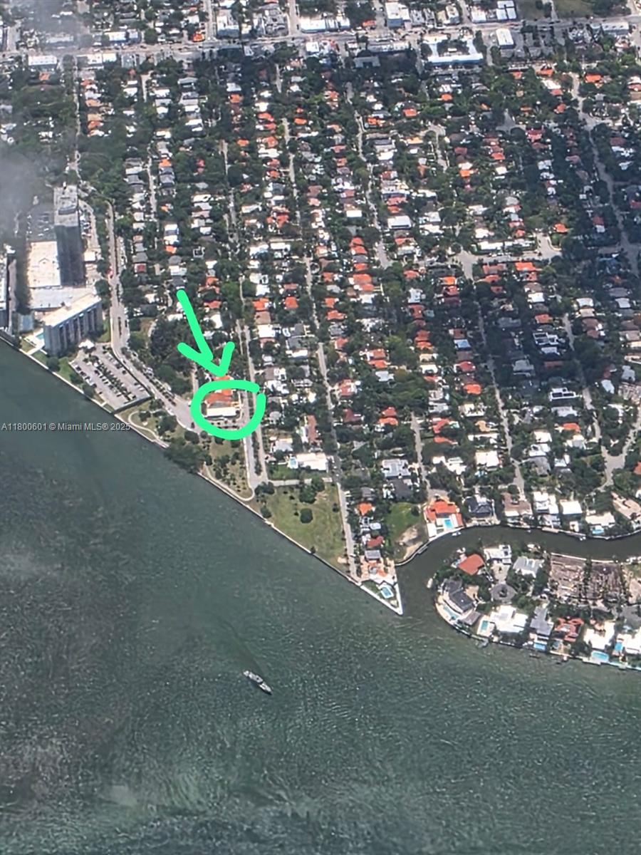 LOW MOVE- IN COSTS ! OCEAN VIEW from almost every room ! This 3-bedroom + DEN, 3-bath home is located on a quiet, tree-lined street with ocean view in Miami’s desirable Bayside Historic District. It features a large fenced yard, in-unit washer and dryer, and a spacious garage with a window and full bathroom—perfect for use as a workshop, craft room, or tool space. Just minutes from Biscayne Blvd, Baywood Park, and the MiMo District.