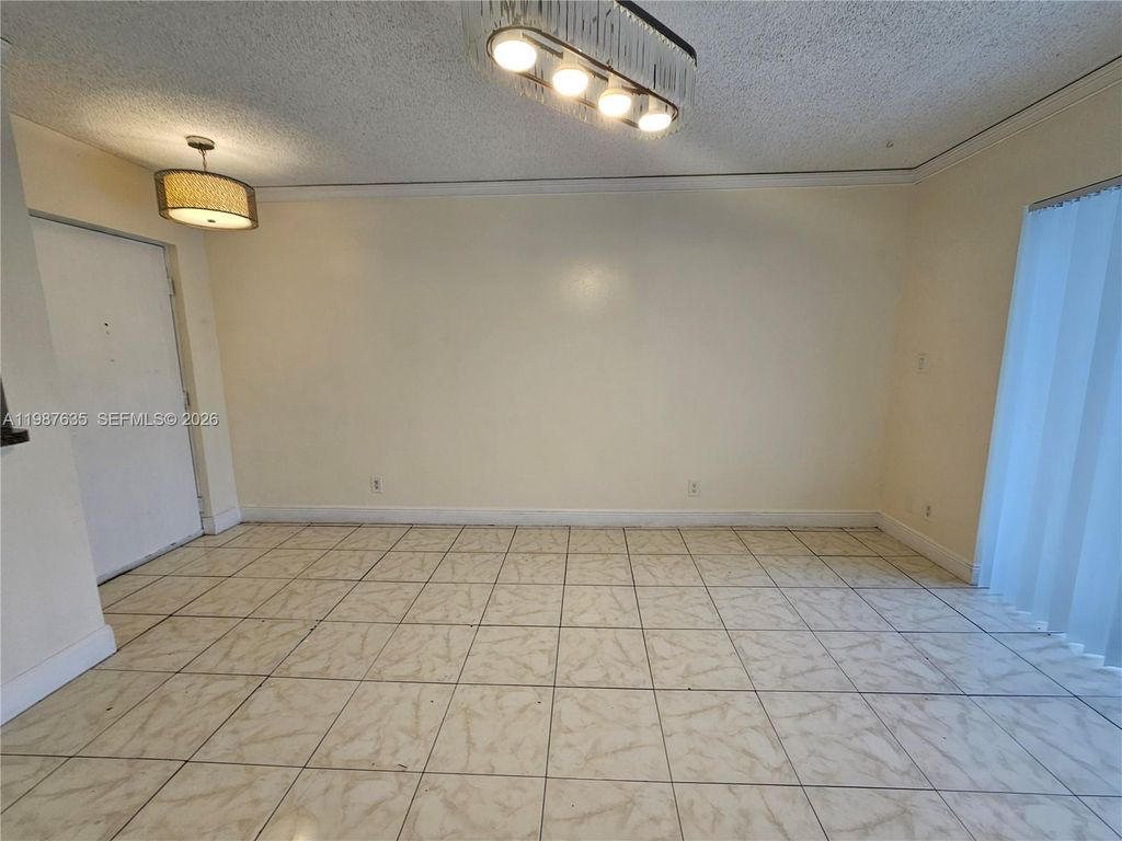 Photo of 5686 Rock Island Rd #126, Tamarac, FL 33319 (MLS # A11987635)