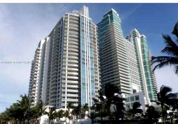 Spectacular 3-bedroom, 3.5-bathroom direct oceanfront condo in a boutique building with only 135 residences. This spacious 3,000 sq.ft. home features a private elevator and lobby. Impeccably finished and furnished with marble floors, recessed lighting, an open kitchen, custom walk-in closets, two large balconies, and a private surround-sound theater. Enjoy access to a fitness center, entertainment area, heated saline pool, and spa. Indulge in world-class services and amenities at the adjacent Hilton Resort, including four restaurants. Pure luxury! Conveniently located one block from a new Publix across from beach and Ocean.
