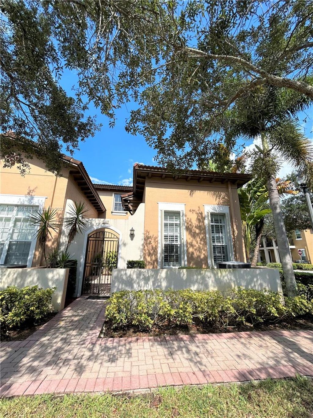 Photo of 1065 SW 147th Ter #1, Pembroke Pines, FL 33027 (MLS # A11390055)