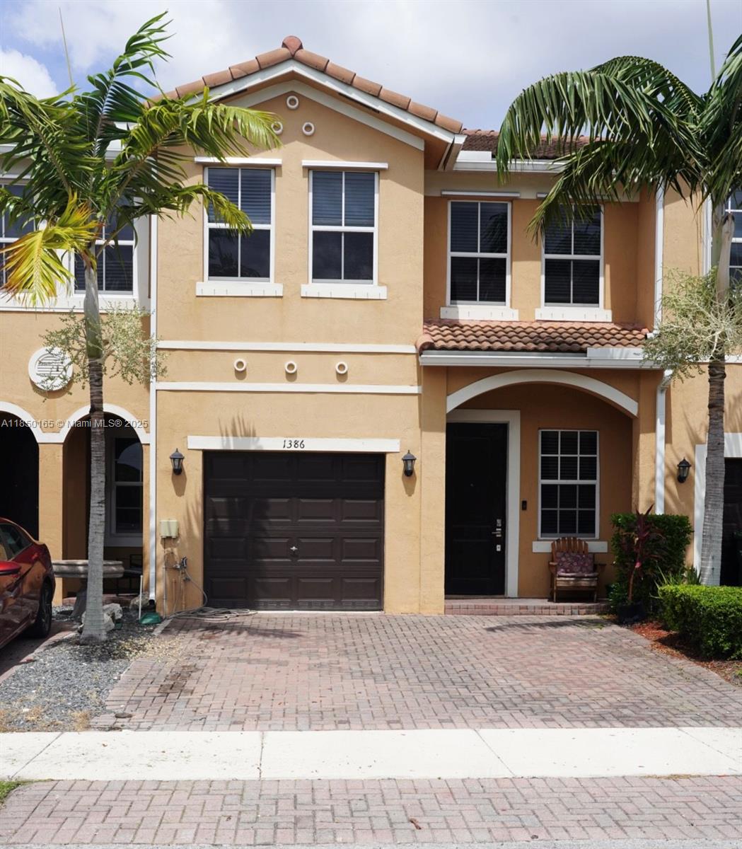 This beautifully maintained 4bedroom, 3-bath townhouse is located in the desirable Keys Garden community. The home features an open-concept layout with One Bedroom and Bath Located on the first floor. Upstairs you'll find the Primary suite with a private bath, plus Three additional bedrooms and a full bathroom as well as the luandry room . Enjoy outdoor living in the backyard overseeing the lake view. Additional features include 1 car Garage with 2 parking spots in the front. Located near shops, schools, and major highways with easy access to the Florida Keys, this home offers comfort, convenience, and low-maintenance living