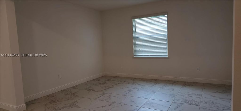 Photo of 4650 SW Quezon St, Port St Lucie, FL 34953 (MLS # A11934260)