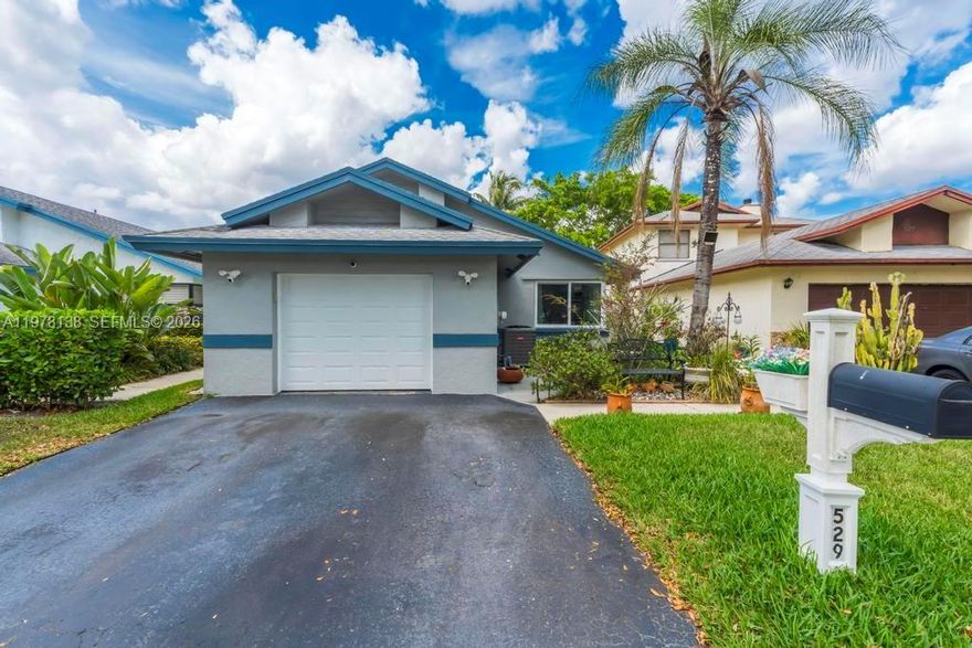 Beautifully updated home with a functional floor plan that offers an open feel while maintaining separation between living areas. Major upgrades include a BRAND NEW ROOF (2026), IMPACT WINDOWS AND DOORS, New A/C, and a Newer Split A/C unit in the garage as well. Interior features include New Luxury Tile Flooring throughout, a fully remodeled guest bathroom, and a completely renovated primary bathroom, all completed with permits. Spacious, well-designed kitchen featuring white real wood cabinetry and a convenient side coffee bar/tea station. Fully enclosed screened patio with peaceful lake and fountain views. Large backyard with room for a pool and several variations of exotic fruit trees! Two-car garage with upgraded flooring. HOA covers common areas and community pool. Conveniently located near parks, dining, shops, I-75 and 595 for ease of commuting, and zoned for Weston-area A+ schools with the benefit of lower Sunrise taxes.