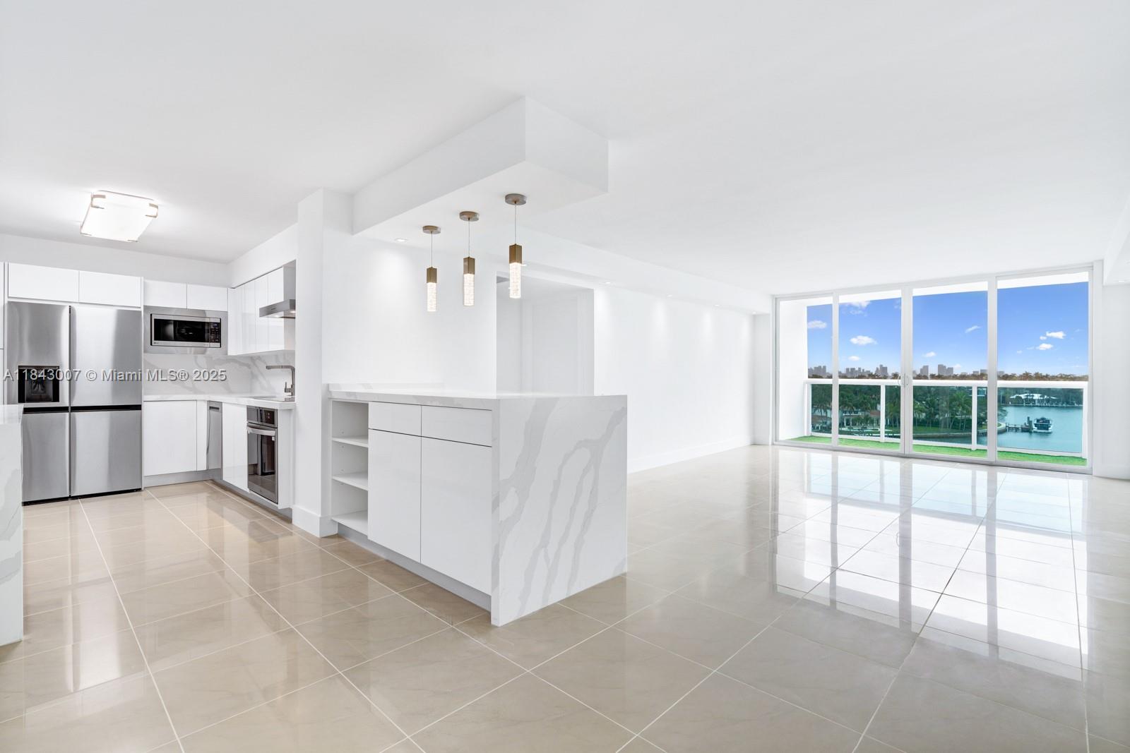 Step Inside with Me! Wake up to Miami's best intracoastal views in this lovely 2 bedroom, 2 bath corner residence at Aquasol in the heart of Miami Beach. Newly renovated, 1,300+ SF of interiors offer a split living plan and include a brand-new kitchen with sleek white lacquer cabinetry and top of the line appliances, carefully crafted custom closets, upgraded baths and flooring, and newly installed impact windows and sliding doors to maximize this home's natural light and water views throughout. This chic and contemporary turnkey abode truly stands out from the rest and features smart home technology for easy living. Conveniently located minutes from the ocean, Bal Harbour Shops, Surfside, and SoBe.
