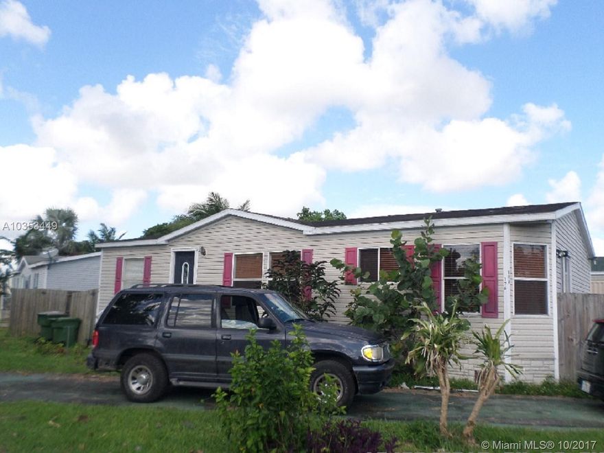 Centrally located manufactured home. Walking distance to US1 & Harris Field. This 2 bedroom & 2 bathroom features crown moulding through out. For your privacy there is a wood picket fence and concrete slab for parking. Affordable monthly HOA fees and you own your lot! Great for Investors, close and fund your transaction with no rental restriction.