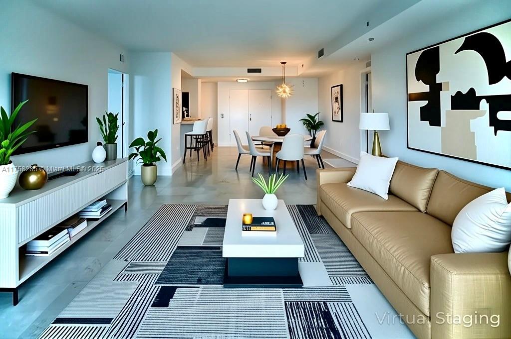 Refined luxury meets resort ease in the Tower Residences at the Ritz Carlton Coconut Grove! two-bed, two-and-a-half-bath gem offers a spacious layout and top-of-the-line hotel amenities, such as a hot tub, pool, and gym. Marble floors, roomy closets, a washer/dryer, and an open-concept kitchen are just a few of the amazing features you will enjoy while living here. Relax on two private balconies, with partial water views from the primary bedroom’s balcony. Impact glass windows ensure security during stormy seasons. This unit includes assigned parking and valet. You’ll surely experience the leisurely lifestyle at 3400 SW 27th Ave!