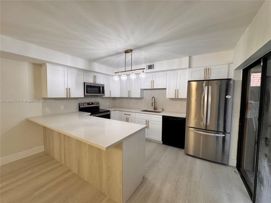 Exquisite fully remodeled townhouse in the heart of Greenacres, FL! This beautiful 3-bedroom, 3-bathroom home offers a spacious and functional layout, including one bedroom and full bathroom conveniently located on the first floor. Enjoy a modern open-concept design, ideal for comfortable living and entertaining. The home features a large screened-in patio — perfect for family gatherings, barbecues, or relaxing evenings outdoors — complete with papaya and avocado tree for a touch of tropical charm. Located in a quiet, well-maintained neighborhood close to shopping, dining, and major highways. Additional highlights include a newer roof (2021) and a prime location that makes this townhouse a true gem. Move-in ready and waiting for you to call it home!